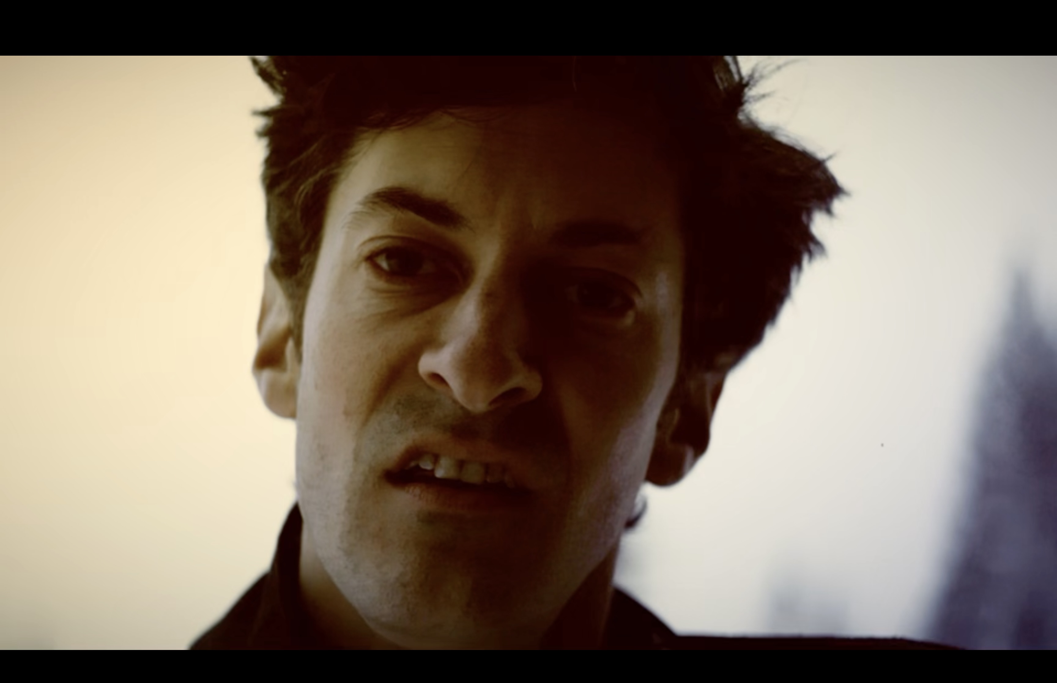 Jacob Milstein close up from the video for Christ on the Cross, film by Ryan Andrews